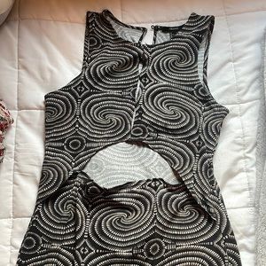 Forever 21 body con dress. Funky spiral pattern. Cutouts .